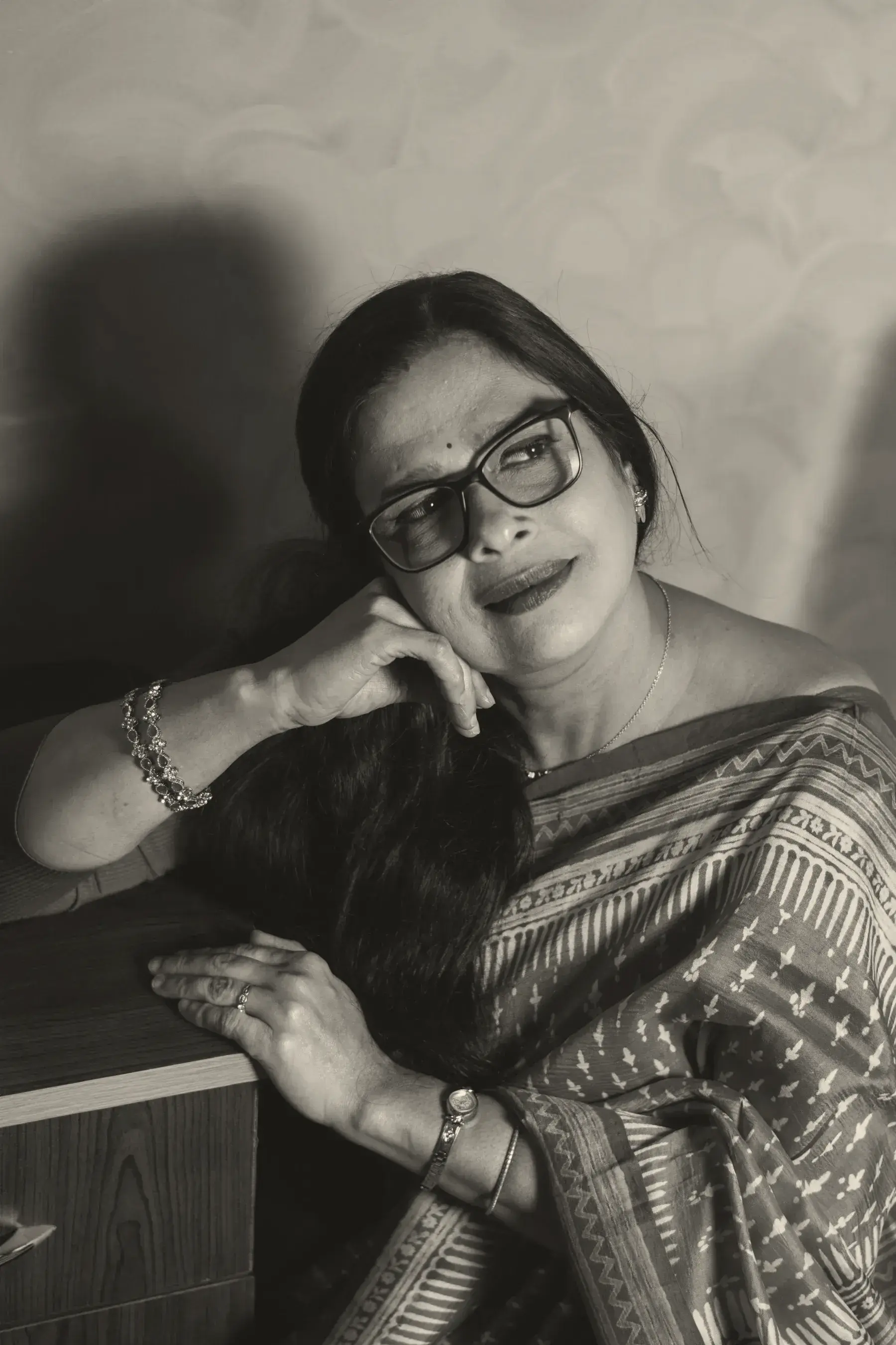 The editor of Resham House, in a Sambalpuri ikat saree, resting her chin on her hand